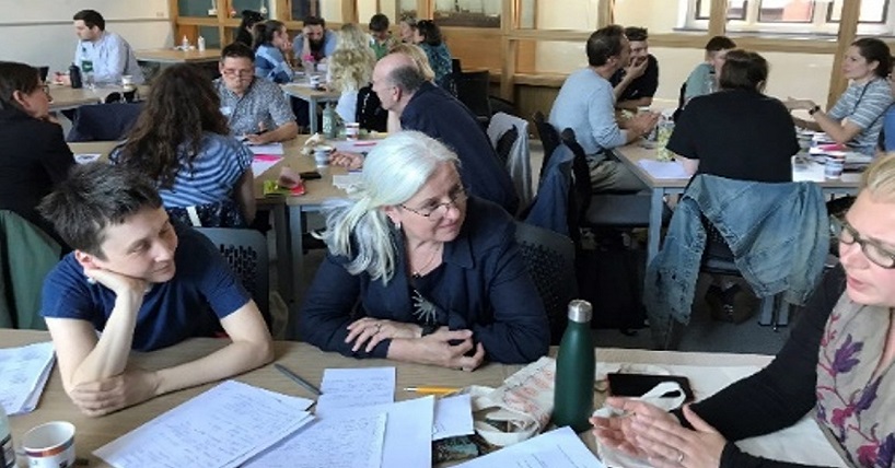 Group discussing around a table.